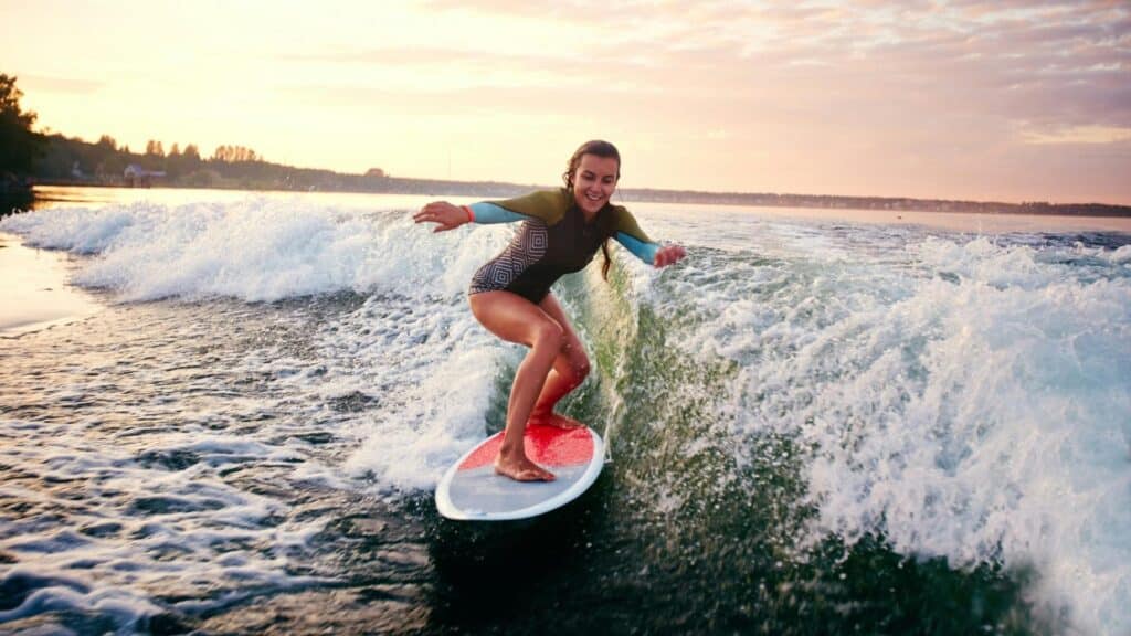 An image of a female surfer surfing a wave