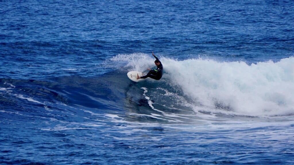 An image of a surfer performing a forehand cutback on a wave