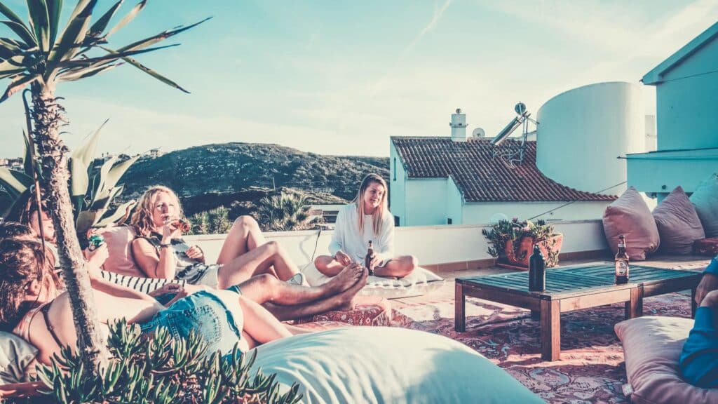 An image of a group of solo travelling rapture surf camp guests socialising