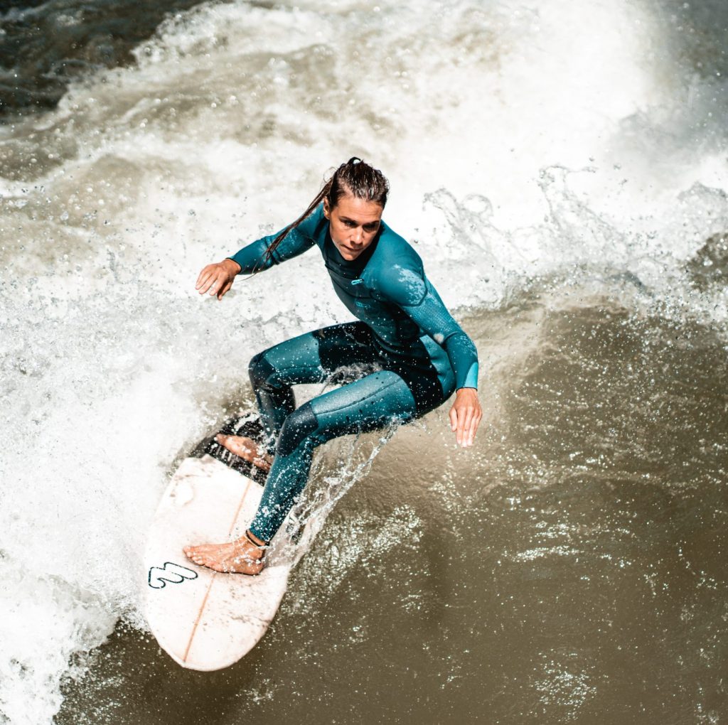 Girl shreds in a cute teal fullsuit.